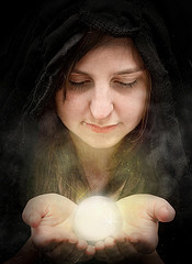 woman looking into crystal ball