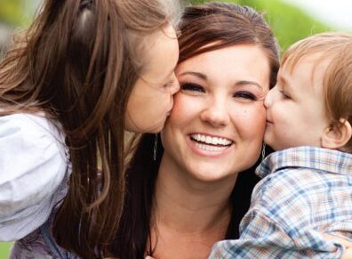 kids kissing mum