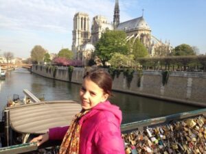 child in front of Pont d L'Archeveche in Paris