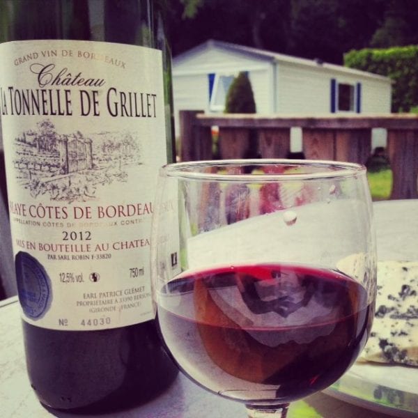 The best part of a caravan holiday? Relaxing with a bottle of local wine, a fresh baguette and farmhouse cheese.