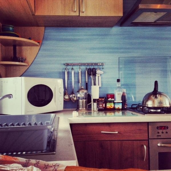 The kitchen of our Vivaldi mobile home at Domaine des Ormes was well kitted out and had six of everything.