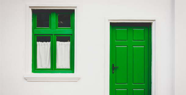 Building with green doors by Buzac Marius via Unsplash