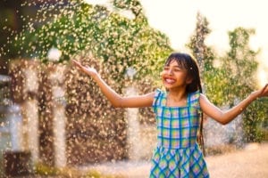Girl in rain by Patrick Foto via Shutterstock