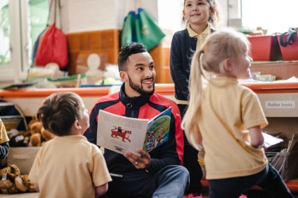 Footballer Theo Walcott reads to kids
