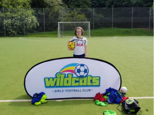 girl with football SSE Wildcats on BritMums