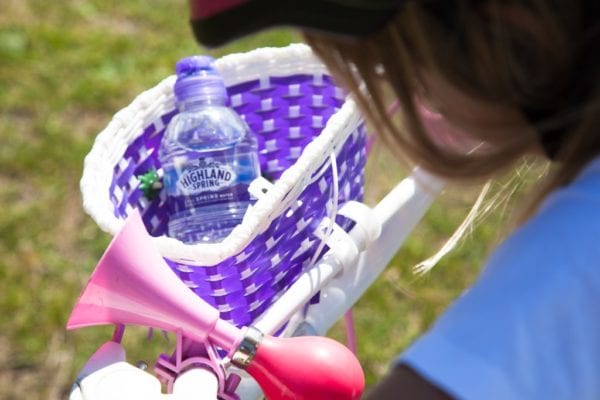 Highland Spring water bottle in bike basket