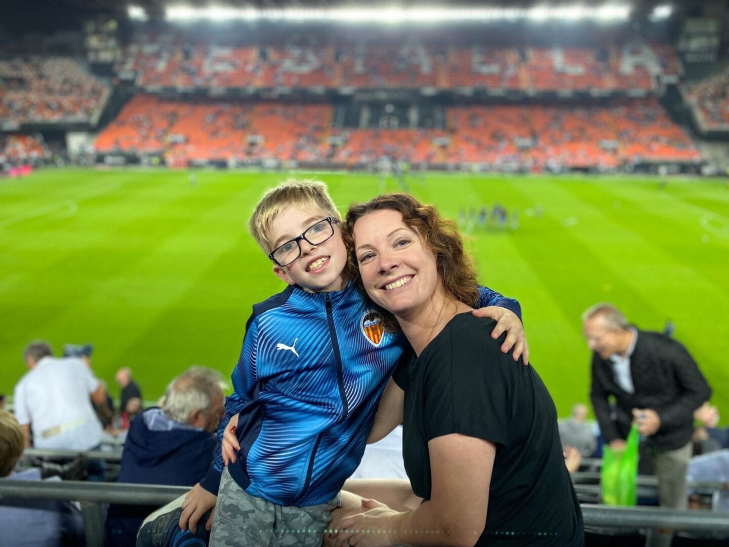 Di Coke and her son at a Valencia football match