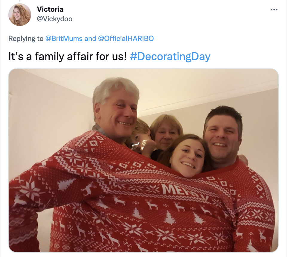 family in one giant Christmas jumper