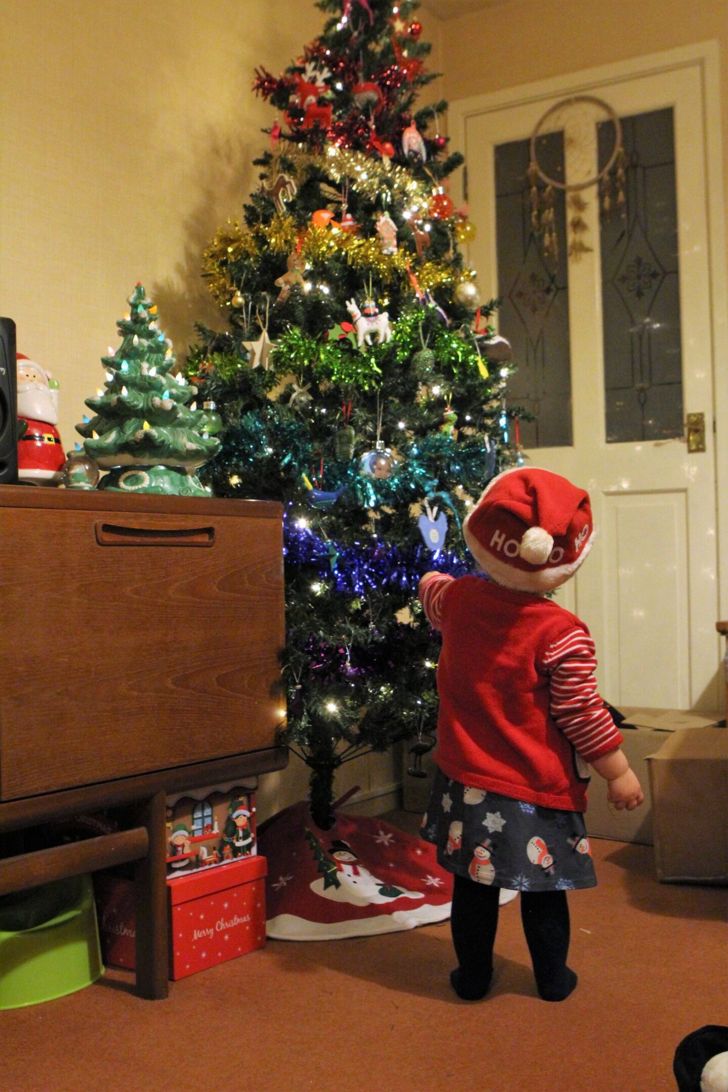 toddler decorating the family tree