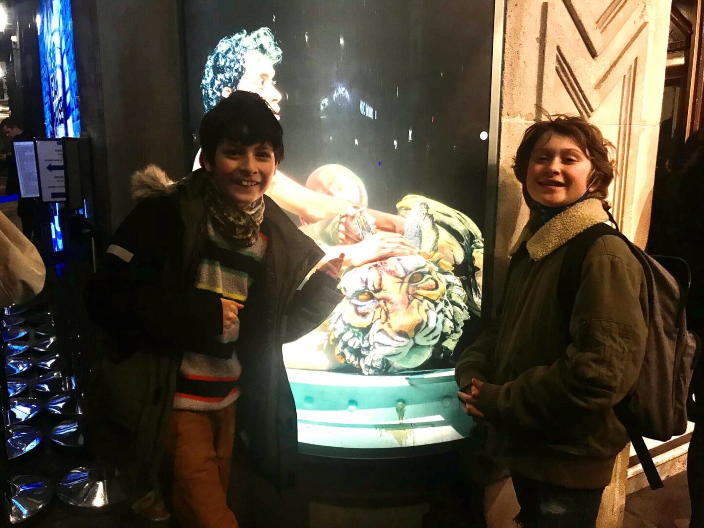 Two boys outside the Life of Pi theatre show in London