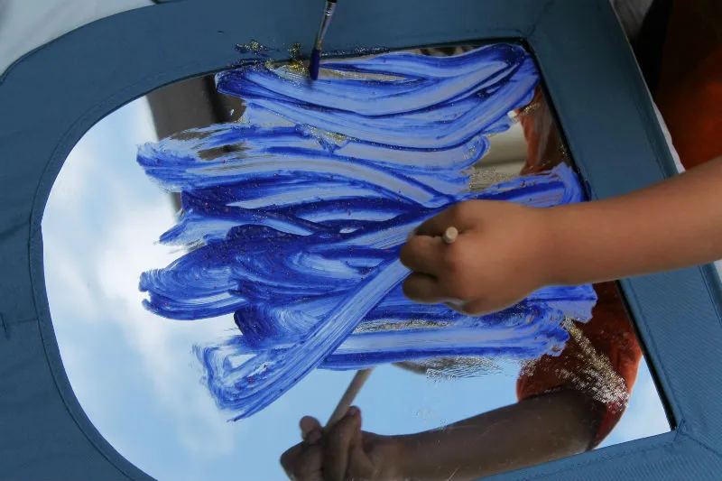 Painting shimmer paint on a mirror or kids